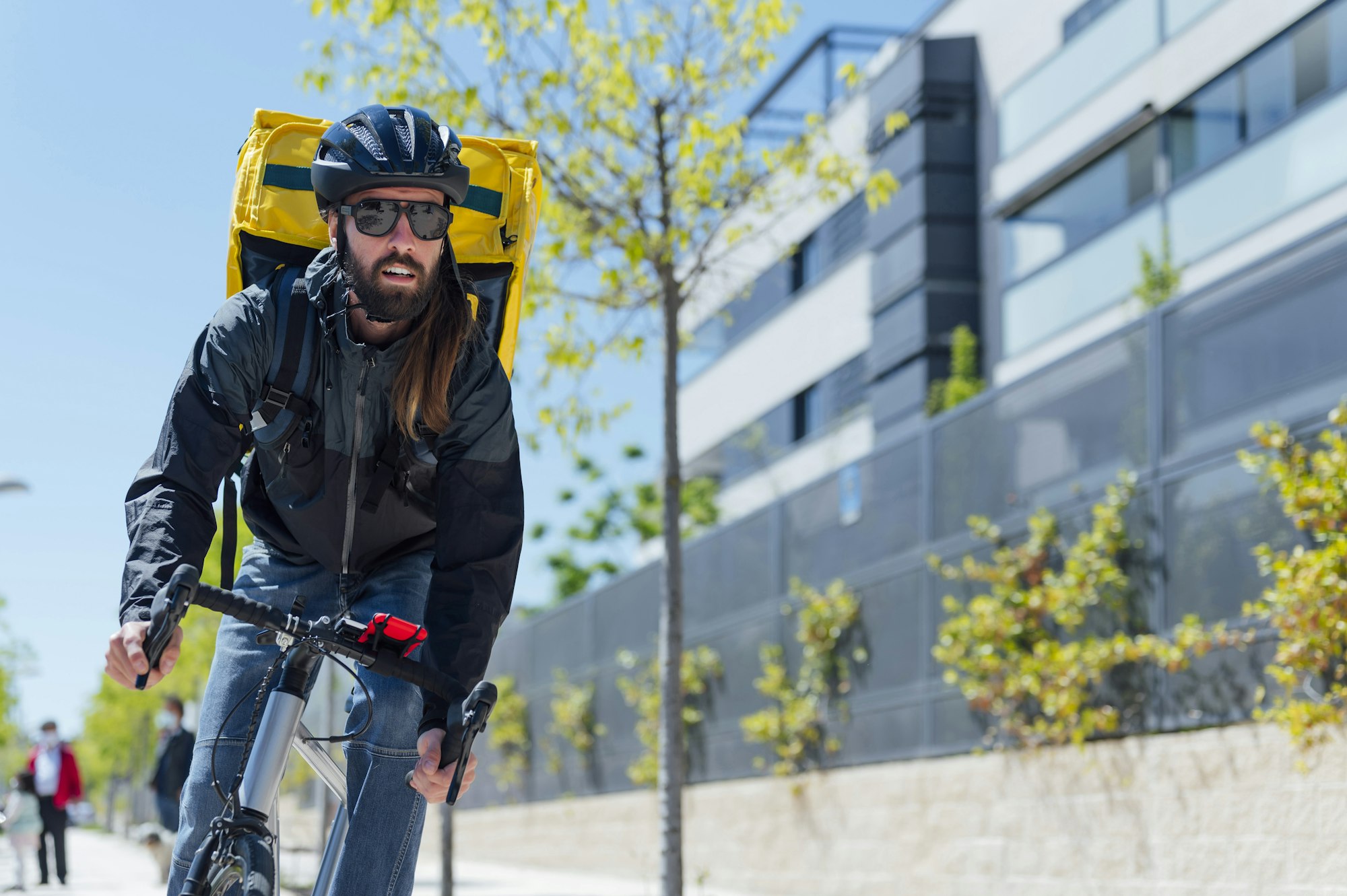 Courier with bicycle delivering packages in the city. Copy space.